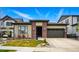 Charming single-story home featuring a brick facade, manicured lawn, and an attached two-car garage at 6469 Barnstead Dr, Castle Pines, CO 80108