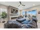 Cozy living room with modern fireplace, TV, and sliding doors to a deck at 6469 Barnstead Dr, Castle Pines, CO 80108