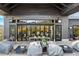 Inviting outdoor patio area with ample seating and a covered space for dining and relaxation at 6469 Barnstead Dr, Castle Pines, CO 80108