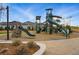 Gathering-friendly community playground with climbing structures and slides at 6469 Barnstead Dr, Castle Pines, CO 80108