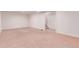 Unfinished basement with neutral carpet offers a blank canvas for customization, near the stairway at 1285 Elder St, Denver, CO 80221