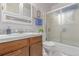 Bathroom with a vanity and glass door shower at 1285 Elder St, Denver, CO 80221