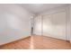 Bright bedroom featuring hardwood floors and a closet at 1285 Elder St, Denver, CO 80221