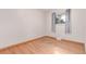 Bedroom with hardwood floors, closet space, and natural light at 1285 Elder St, Denver, CO 80221