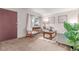 Cozy living room features neutral carpet, a large window, and comfortable seating at 1285 Elder St, Denver, CO 80221