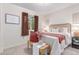 Bedroom featuring carpet flooring, a woven headboard, and curated décor at 1285 Elder St, Denver, CO 80221