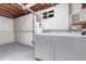 Utility room features white walls, a window, washer, and dryer, offering practicality and efficiency at 1285 Elder St, Denver, CO 80221