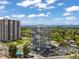 Beautiful aerial view of condo buildings with pool, tennis court, and lush green landscape at 3100 E Cherry Creek South Dr # 404, Denver, CO 80209