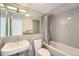Clean, classic bathroom featuring a bathtub, and sink with simple finishes at 3100 E Cherry Creek South Dr # 404, Denver, CO 80209