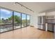 Bright kitchen with large windows, stainless steel appliances, and hardwood floors at 3100 E Cherry Creek South Dr # 404, Denver, CO 80209