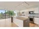 Bright, modern kitchen with large window, stainless appliances, and hardwood floors at 3100 E Cherry Creek South Dr # 404, Denver, CO 80209