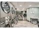 Well-maintained laundry room featuring multiple commercial grade washer and dryers at 3100 E Cherry Creek South Dr # 404, Denver, CO 80209