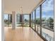 Spacious living room with floor-to-ceiling windows providing abundant natural light and community views at 3100 E Cherry Creek South Dr # 404, Denver, CO 80209