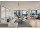 Inviting living room featuring comfortable seating, city views, and modern decor at 3100 E Cherry Creek South Dr # 404, Denver, CO 80209