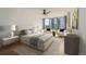 Well-lit main bedroom with ceiling fan, and large windows providing natural light and views at 3100 E Cherry Creek South Dr # 404, Denver, CO 80209