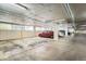 Well-lit parking garage showcasing available parking spots for residents at 3100 E Cherry Creek South Dr # 404, Denver, CO 80209