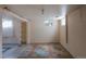 Basement space featuring tiled floor, shelves, and window at 1540 S Knox Ct, Denver, CO 80219