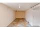 Spacious basement with geometric tiled floor and plain white walls at 1540 S Knox Ct, Denver, CO 80219