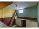 Basement workshop with pegboard walls, bench, and window at 1540 S Knox Ct, Denver, CO 80219