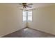 Neutral bedroom featuring carpet, a corner window with light and ceiling fan at 1540 S Knox Ct, Denver, CO 80219