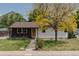 Lovely single-story home with beautiful mature tree providing ample shade at 1540 S Knox Ct, Denver, CO 80219