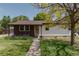 Charming single story home with beautiful landscaping and large tree at 1540 S Knox Ct, Denver, CO 80219