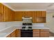 Well-equipped kitchen with ample cabinet space and a modern gas range at 1540 S Knox Ct, Denver, CO 80219