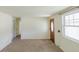 Cozy living room with a classic front door and a bright window at 1540 S Knox Ct, Denver, CO 80219