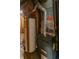 Furnace and water heater with venting in unfinished area of basement of home at 1540 S Knox Ct, Denver, CO 80219