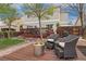 Inviting backyard deck area with a modern fire pit and comfortable seating, perfect for outdoor relaxation at 10475 E Abilene St, Commerce City, CO 80022