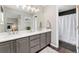 Bright bathroom with double sinks, a large mirror, and plenty of counter space for comfortable mornings at 10475 E Abilene St, Commerce City, CO 80022