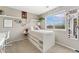 Cozy bedroom designed with personalized decor, floating shelves, and a view of the outside scenery at 10475 E Abilene St, Commerce City, CO 80022