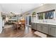 Open dining area with hardwood floors flowing into the kitchen at 10475 E Abilene St, Commerce City, CO 80022