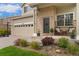 Inviting front porch with chairs, plants, and charming brickwork details at 10475 E Abilene St, Commerce City, CO 80022