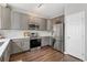 Bright kitchen featuring stainless steel appliances and subway tile backsplash at 10475 E Abilene St, Commerce City, CO 80022
