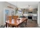 Charming kitchen area with stainless steel appliances, and adjacent dining area at 10475 E Abilene St, Commerce City, CO 80022