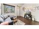 Comfortable living room with large windows, hardwood floors, and modern decor at 10475 E Abilene St, Commerce City, CO 80022
