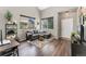 Comfortable living room with large windows, hardwood floors, and modern decor at 10475 E Abilene St, Commerce City, CO 80022