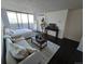 Bright bedroom with large windows offering city views, comfortable seating and plenty of room to relax at 1020 15Th St # 21M, Denver, CO 80202
