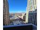 Stunning city view from balcony, showcasing the Denver skyline and snow capped Rocky Mountains at 1020 15Th St # 21M, Denver, CO 80202