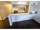 Modern kitchen with stainless steel refrigerator, stove and bar seating, excellent for entertaining at 1020 15Th St # 21M, Denver, CO 80202