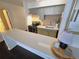 Well lit kitchen with sleek countertops and modern appliances in neutral tones creating a clean aesthetic at 1020 15Th St # 21M, Denver, CO 80202