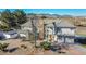 Beautiful home with large driveway, mature trees, and mountain views in a peaceful neighborhood at 14955 W 58Th Pl, Golden, CO 80403