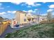 The expansive yard includes a shed and a concrete patio area with a fire pit and chairs at 14275 Grape St, Thornton, CO 80602