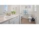 Bathroom featuring a vanity with marble countertop, mirror and a separate shower/toilet area at 14275 Grape St, Thornton, CO 80602