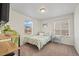 Bright bedroom with two windows, neutral carpet and a comfortable bed at 14275 Grape St, Thornton, CO 80602