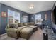 Cozy living room with comfortable couches, large windows, and decorative accents at 14275 Grape St, Thornton, CO 80602
