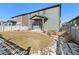 The backyard features a well-maintained lawn and privacy fence, perfect for outdoor activities and relaxation at 6591 N Ceylon St, Denver, CO 80249