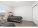 Inviting bedroom featuring two beds, neutral carpet, and a closet at 6591 N Ceylon St, Denver, CO 80249