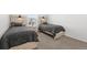 Bright bedroom with two comfortable beds, perfect for guests at 6591 N Ceylon St, Denver, CO 80249